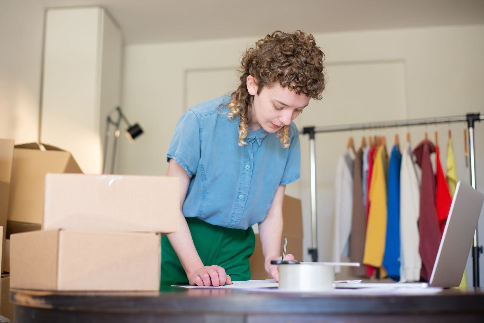 Online shop owner preparing orders in her studio